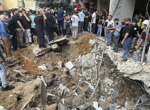 Israel says its strike on Beirut killed a top Hezbollah military official as Lebanon reports 14 died