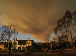 With their Los Angeles-area homes still smoldering, families return to search the ruins for memories