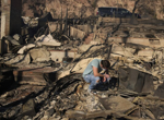 With their Los Angeles-area homes still smoldering, families return to search the ruins for memories