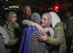 Live updates: Three Israeli hostages arrive in Israel as ceasefire passes first hurdle