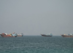 A US official says an Iranian drone strike hit the vessel, impacting movement in the key waterway
