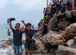 Spain mobilises troops to Ceuta as thousands of migrants continue to swim across the border from Morocco